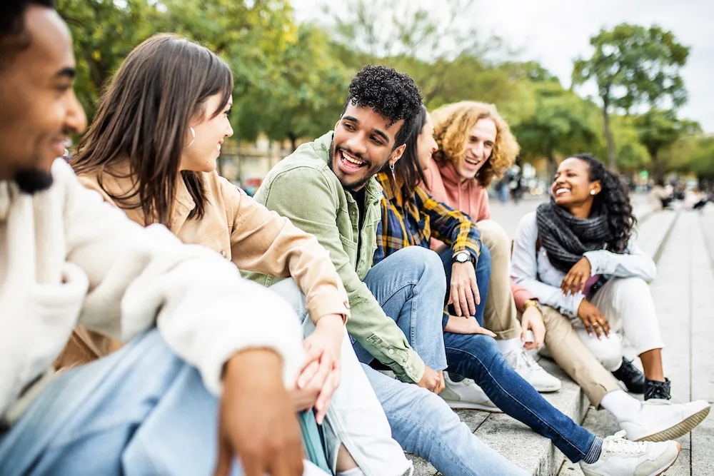 Group of friends sitting outside on the steps